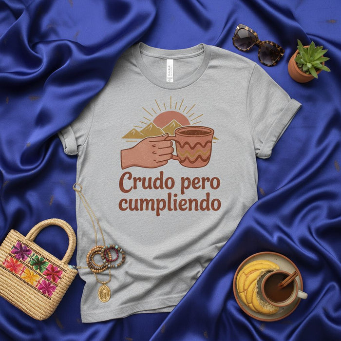 Crudo pero cumpliendo T-Shirt | Funny Spanish Coffee Morning Shirt | Mexican Saying Tee | Hand Holding Mug Sun Sunrise Graphic Design | Unisex Gift for Him Her