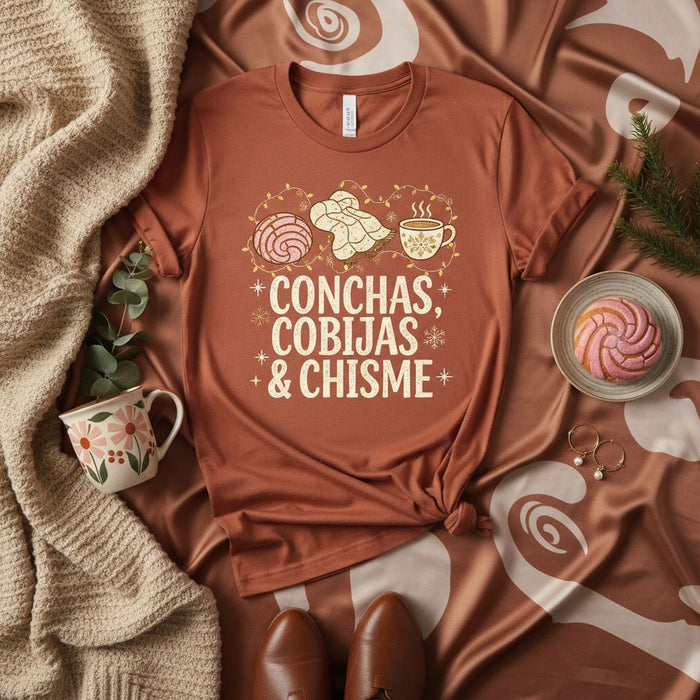 Conchas Cobijas Chisme T-Shirt | Cozy Pan Dulce and Coffee Shirt | Unisex Latina Mexican Food Lover Gift Tee with Concha Bread Design for Winter Holidays