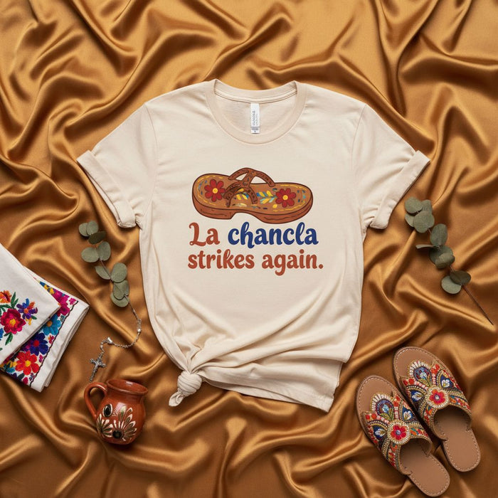 La chancla strikes again. T-Shirt, Funny Hispanic Mom Gift, Latina Humor Tee, Mexican Culture Shirt, Spanish Phrase Graphic T-shirt, Sarcastic Mother's Day Gift, Embroidered Sandal Design, Beige Unisex Shirt