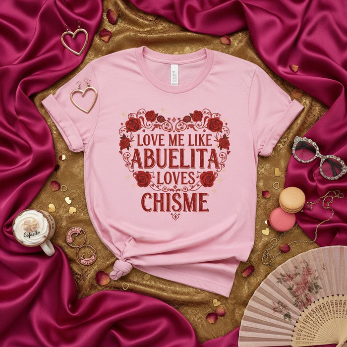 Love Me Like Abuelita Loves Chisme T-Shirt, Funny Hispanic Grandma Quote Tee, Latino Culture Gift, Pink Unisex Shirt with Heart and Roses Design