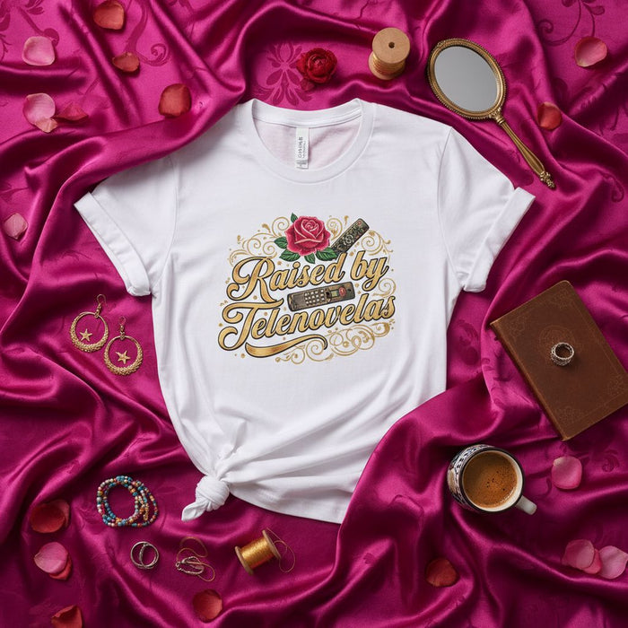 Raised by Telenovelas T-Shirt, Funny Hispanic Latino Culture Tee, Rose and Remote Graphic Top, Unisex Gift for Telenovela Fan, Gold Script Design, Drama Lovers Shirt