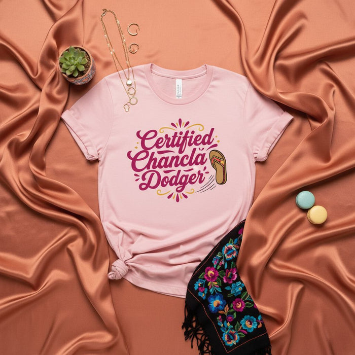 Certified Chancla Dodger T-Shirt | Funny Latino Humor Gift Tee | Pink Unisex Shirt with Spanish & English Slogan | Cultural Meme Graphic Apparel