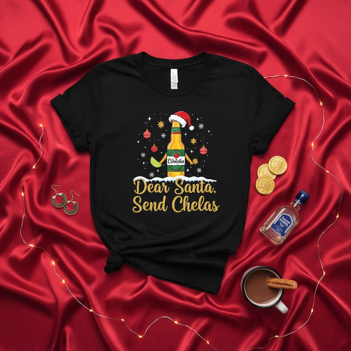 Dear Santa Send Chelas Shirt, Funny Christmas Beer T-Shirt, Holiday Drinking Tee, Mexican Beer Bottle with Santa Hat, Chela Lover Gift, Navidad Celebration Top, Unisex Graphic T-Shirt.
