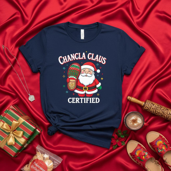 Chancla Claus Certified T-Shirt for Christmas: Funny Santa Holding a Slipper, Holiday Latine Family Gift, Unisex Navy Tee with Spanish and English Text