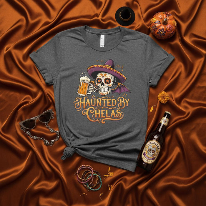 Haunted By Chelas Day of the Dead Sugar Skull T-Shirt with Sombrero, Beer Mug, and Bat Wings - Funny Halloween Calavera Graphic Tee for Men and Women