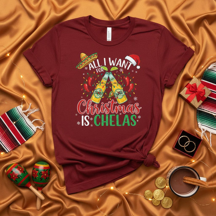 All I Want for Christmas is Chelas T-Shirt, Funny Mexican Christmas Shirt, Chela Beer Holiday Tee, Christmas Fiesta, Cinco De Mayo Style, Chili Peppers, Sombrero, Santa Hat, Unisex Graphic T-Shirt Gift