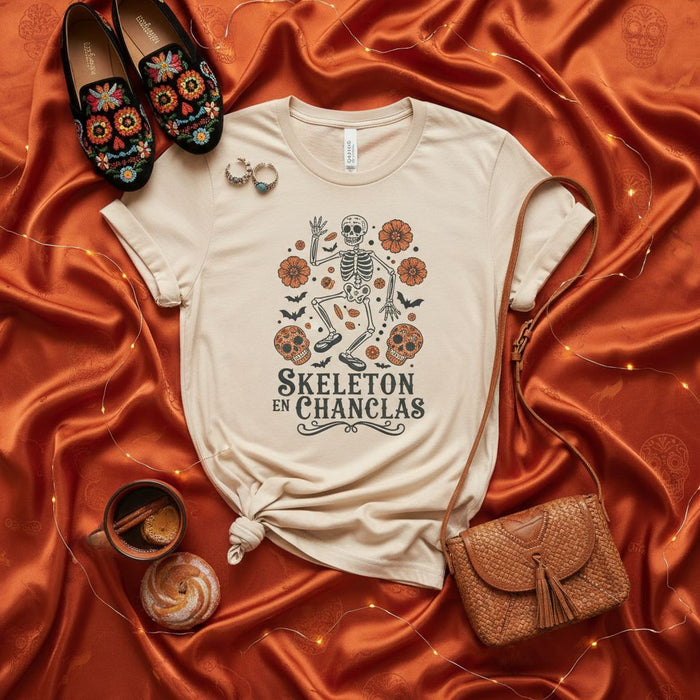 Skeleton En Chanclas T-Shirt, Day of the Dead Shirt, Funny Spanglish Skeleton Tee, Dia de los Muertos, Sugar Skull, Fall Halloween Unisex T-Shirt, Cempasúchil Marigold Flowers, Bat, Folk Art Style Graphic Tee