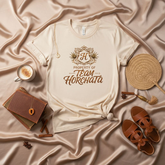 PROPERTY OF TEAM HORCHATA T-Shirt, Unisex Soft Cream Tee, "H" Crest Design, Horchata Drink Lover Gift, Agave Plant Graphic Shirt, Cultural Beverage Apparel, Comfortable Casual Wear Top