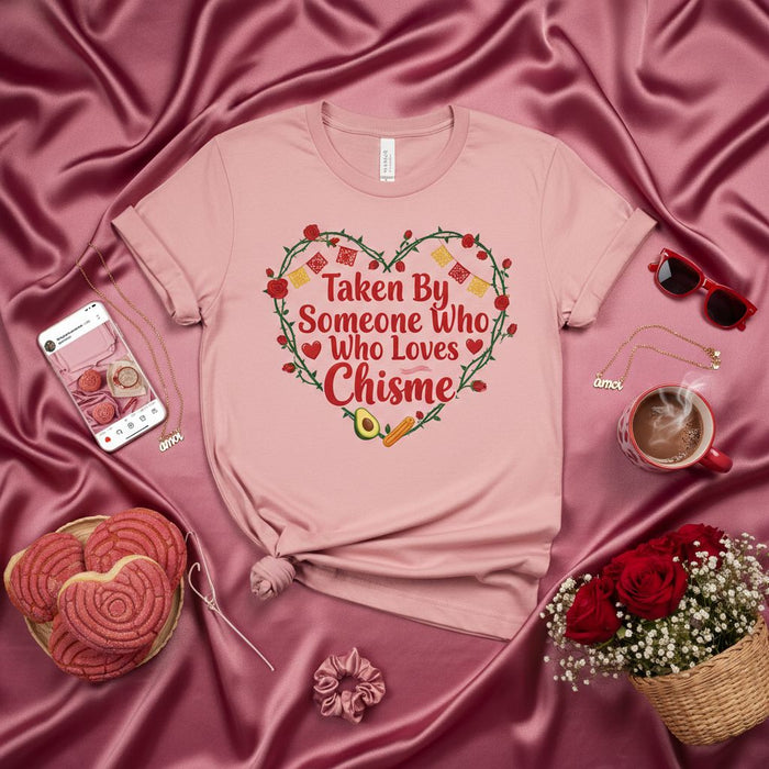 Taken By Someone Who Loves Chisme Shirt, Funny Latina Valentine's Day Gift, Corazón, Mexican Candy, Avocado, Carrot, Roses, Conchas, Spanish English Mix T-Shirt for Women, Men, Unisex, Pink Tee with Red Heart Design.