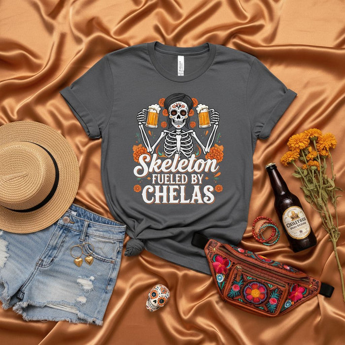 Skeleton Fueled By Chelas Day of the Dead Shirt, Funny Dia de Muertos Sugar Skull Skeleton Drinking Beer T-Shirt, Halloween Fiesta Party Unisex Tee, Marigold Flowers Graphic Shirt for Men and Women