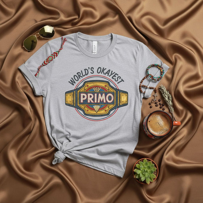World's Okayest Primo T-Shirt, Funny Latino Cousin Shirt, Wrestling Championship Belt Graphic Tee, Hispanic Family Humor Gift Idea for Brother or Friend, Unisex Jersey Short Sleeve Top
