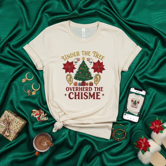 Under the Tree Overheard the Chisme Christmas T-Shirt, Funny Holiday Gossip Tee with Poinsettias and Christmas Tree Graphic, Unisex Short Sleeve Shirt for Spanish Speakers and Lovers of Holiday Cheer