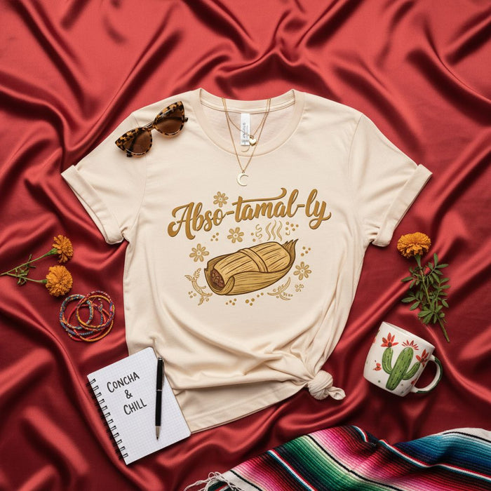 Camiseta "Abso-tamal-ly" con juego de palabras de comida mexicana, diseño de concha y relax, unisex, regalo para amantes de los tamales, top de manga corta con gráficos.
