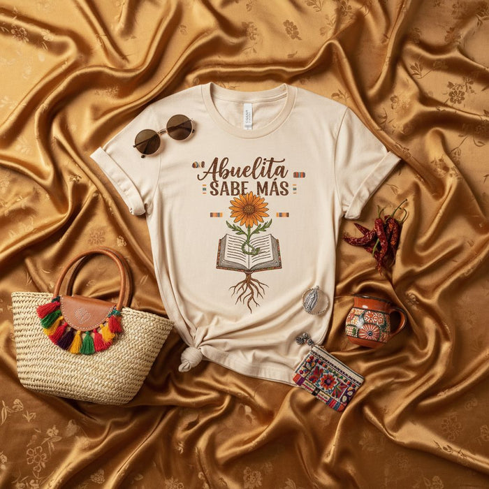 Abuelita Sabe Más Sunflower Book Roots T-Shirt, Mexican Fiesta Grandma Tee, Day of the Dead Shirt, Hispanic Heritage Month Gift, Dia de Muertos Abuela Top, Boho Style Graphic Novelty Shirt