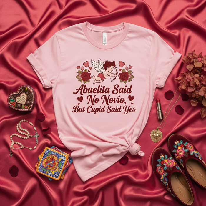 Abuelita Said No Novio, But Cupid Said Yes T-Shirt: Funny Latina Valentine's Day Shirt, Cute Spanish Grandparent Joke Tee, Mexican-American Culture Gift, Pink Unisex Love Graphic Top