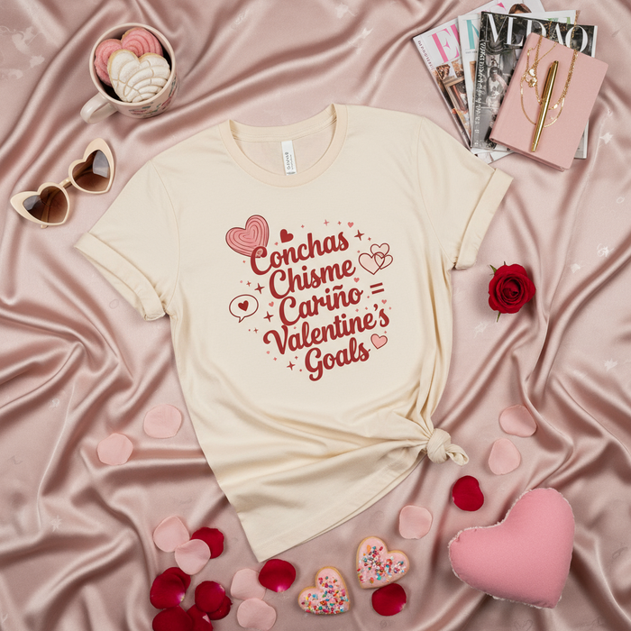 Conchas Chisme Cariño Valentine's Goals T-Shirt, Cute Latinx Valentine's Day Gift for Her, Unisex Graphic Tee with Hearts and Spanish Words.