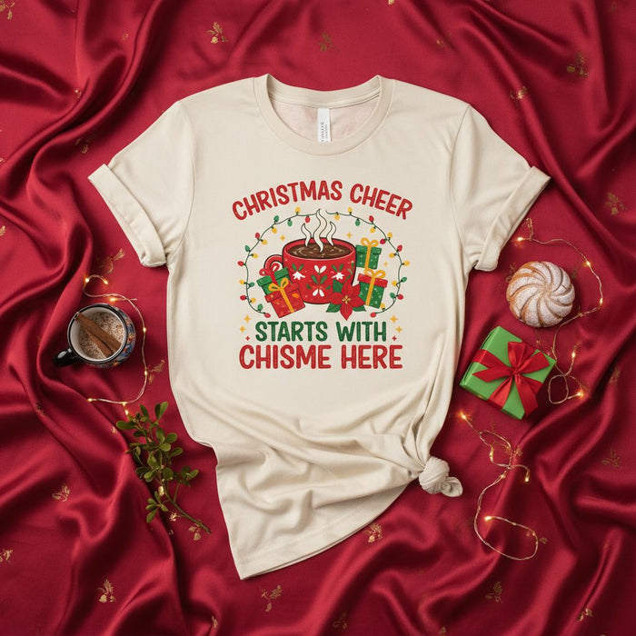 Christmas Cheer Starts with Chisme Here T-Shirt, Funny Holiday Gift for Gossip Lovers, Latina Christmas Shirt, Cozy Hot Cocoa Mug and Present Graphic Tee, Unisex Festive Apparel for Friends and Family.