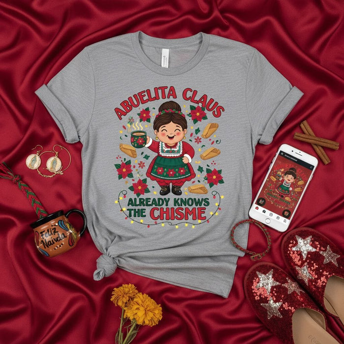 Abuelita Claus Already Knows The Chisme Christmas T-Shirt, Funny Hispanic Grandma Holiday Tee, Mexican Family Gift, Cute Latinx Holiday Apparel with Tamales and Poinsettias Mexicada