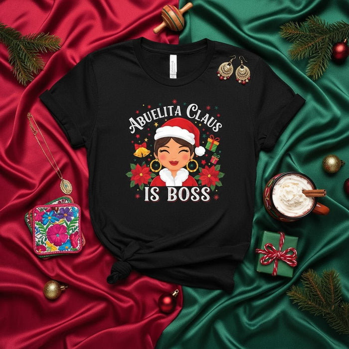 Abuelita Claus Is Boss Christmas Shirt, Latina Grandma Holiday T-Shirt, Mexican Abuela Festive Tee, Funny Christmas Gift for Grandmother, Family Matching Xmas Top, Poinsettia Bells Present Santa Hat Design Mexicada