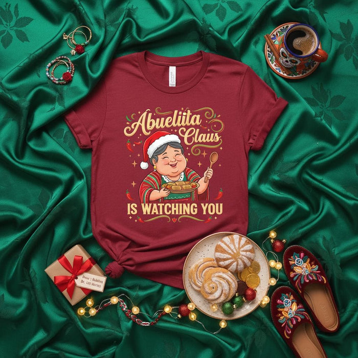 Abuelita Claus Is Watching You Funny Spanish Christmas T-Shirt Grandma Mexican Holiday Tee Food Chef Cooking Latinx Gift Idea Festive Xmas Tee Shirt for Women Men Unisex Family Gathering Mexicada