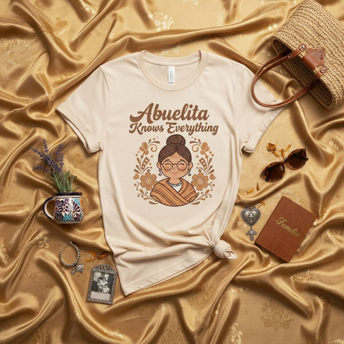 Abuelita Knows Everything T-Shirt, Funny Spanish Grandmother Tee, Cute Floral Graphic Unisex Grandma Shirt, Best Abuela Gift Idea for Mother's Day, Birthday, or Christmas Mexicada
