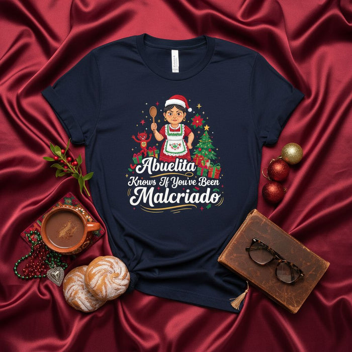Abuelita Knows If You've Been Malcriado T-Shirt | Funny Hispanic Grandma Christmas Shirt | Latina Abuela Holiday Gift Tee | Spanish Saying Malcriado Santa Hat Design Mexicada