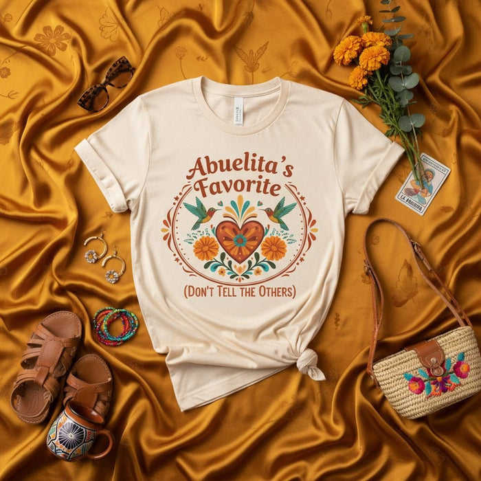 Abuelita's Favorite (Don't Tell the Others) Shirt, Hispanic Grandma Gift, Floral Hummingbird Tee, Funny Family Loved One Present, Neutral Cream Unisex T-Shirt Mexicada