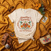 Abuelita's Favorite (Don't Tell the Others) Shirt, Hispanic Grandma Gift, Floral Hummingbird Tee, Funny Family Loved One Present, Neutral Cream Unisex T-Shirt Mexicada