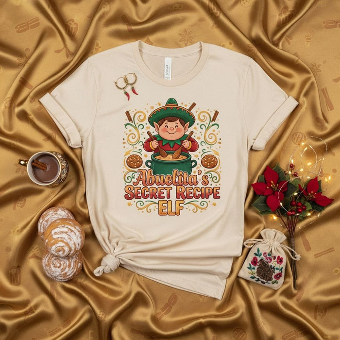 Abuelita's Secret Recipe Elf T-Shirt - Funny Christmas Mexican Chef Tee, Tamale Baking Abuela Gift, Holiday Family Cooking Shirt, Unisex Short Sleeve Top Mexicada