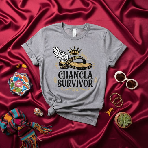 Chancla Survivor Funny Spanish Mom Flip Flop T-Shirt with Crown and Wings, Latina Heritage Humor Tee, La Chancla Gift Idea, Hispanic Culture T-Shirt Mexicada