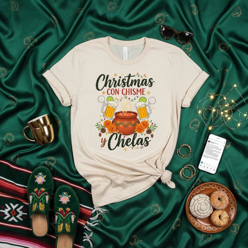 Christmas con Chisme y Chelas T-Shirt, Funny Mexican Christmas Shirt, Hispanic Navidad Tee, Latina Holiday Gift, Cozy Family Gathering Outfit, Marigold Flowers Sugar Skulls Design, Unisex Adult Top Mexicada