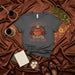 Christmas Fueled by Café de Olla T-Shirt, Mexican Coffee Christmas Shirt, Xmas Poinsettia Tee, Holiday Drink Apparel, Funny Gift for Coffee Lovers, Unisex Graphic T-Shirt Mexicada
