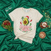 Christmas with Extra Cilantro Funny Avocado Santa T-Shirt, Cute Mexican Food Holiday Tee, Festive Guacamole Chili Pepper Christmas Gift Shirt, Unisex Men's Women's Soft Cream Graphic Top Mexicada