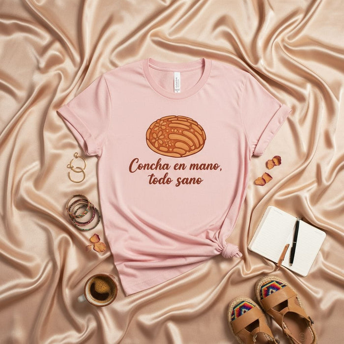 Concha en mano, todo sano Mexican Sweet Bread T-Shirt Unisex, Hispanic Pan Dulce Pastry Comfort Tee, Spanish Language Foodie Shirt, Gift for Latina/Latino, Soft Pink Color Mexicada