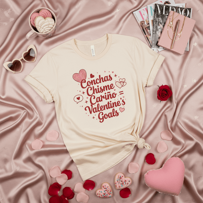 Conchas Chisme Cariño Valentine's Goals T-Shirt, Cute Latinx Valentine's Day Gift for Her, Unisex Graphic Tee with Hearts and Spanish Words. Mexicada