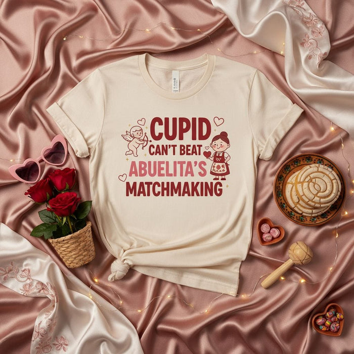 Cupid Can't Beat Abuelita's Matchmaking T-Shirt, Funny Hispanic Grandma Valentine's Day Shirt, Spanish Abuela Love & Family Gift, Unisex Tee Mexicada
