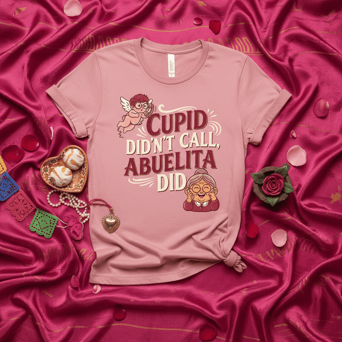Cupid Didn't Call, Abuelita Did Funny Valentine's Day T-Shirt, Abuela Shirt, Spanish Grandma Gift, Cute Anti-Valentine Tee, Pink Unisex Top with Cupid and Abuelita Graphic Mexicada