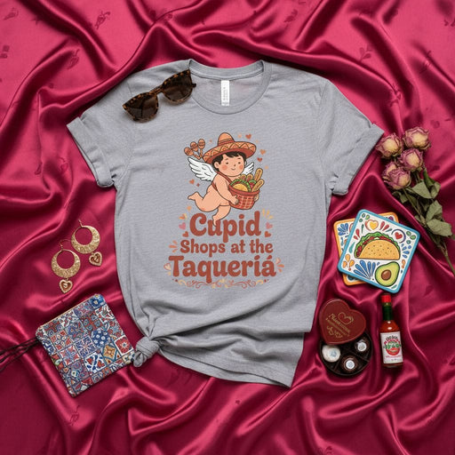 Cupid Shops at the Taquería T-Shirt, Funny Valentine's Day Tee, Cute Cherub with Sombrero, Mexican Food Lover Gift, Taco Tuesday Shirt, Unisex Graphic T-Shirt Mexicada