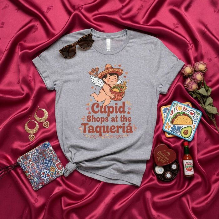 Cupid Shops at the Taquería T-Shirt, Funny Valentine's Day Tee, Cute Cherub with Sombrero, Mexican Food Lover Gift, Taco Tuesday Shirt, Unisex Graphic T-Shirt Mexicada