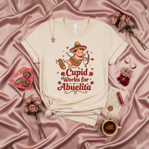 Cupid Works for Abuelita T-Shirt, Cute Mexican Cupid with Sombrero, Funny Spanish Valentine's Day Gift Tee, Grandparent Love, Neutral Unisex Shirt Mexicada