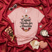 Cupid Works for Abuelita T-Shirt, Cute Spanish Grandma Gift, Valentine's Day Tee, Funny Abuela Love Shirt with Angel and Coffee, Mother's Day Family Apparel, Pink Unisex Shirt Mexicada