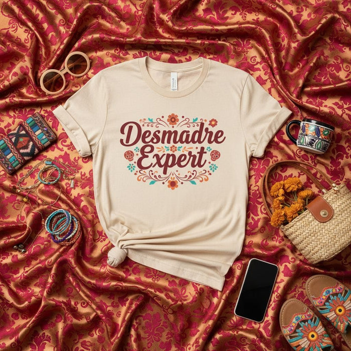 Desmadre Expert Shirt, Funny Latina Mom Gift Tee, Spanish Saying T-Shirt with Flowers, Mexican Fiesta Style Shirt, Cute Desmadre T-Shirt for Women, Unisex Adult T-Shirt Mexicada