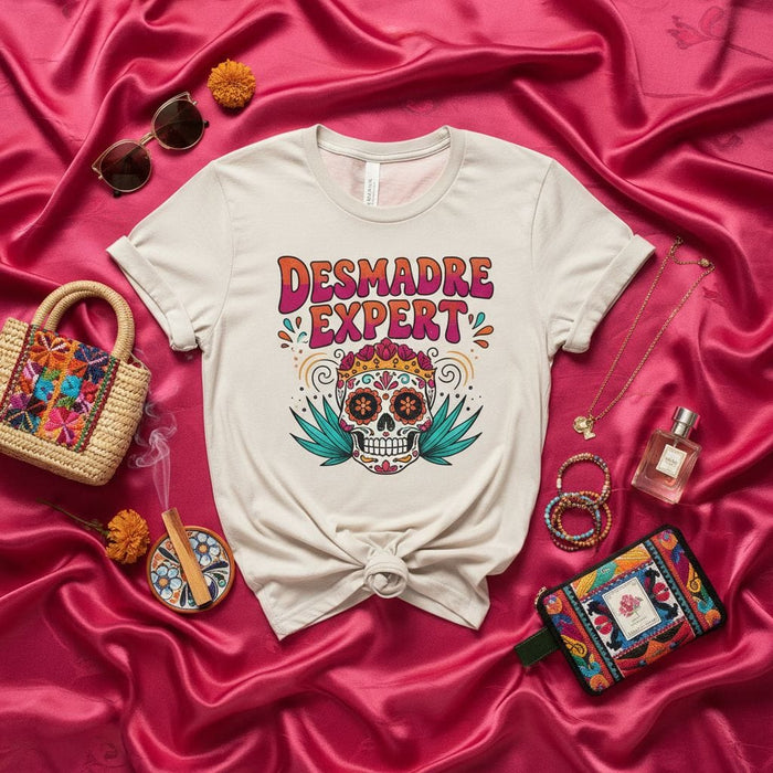 Desmadre Expert T-Shirt with Sugar Skull Design | Funny Mom Life Shirt | Dia de los Muertos Mexican Culture Graphic Tee | Unisex Sizing Mexicada