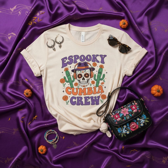 ESPooky Cumbia Crew Sugar Skull Halloween T-Shirt, Spooky Mexican Music Tee, Dia De Los Muertos Calavera Shirt, DJ Skelly with Headphones and Cactuses, Unisex Latin Dance Outfit. Mexicada