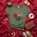 Feliz Navi-Cumbia Christmas Shirt with Record Player, Maracas, Poinsettia, & Music Notes; Spanish Cumbia Holiday Party T-Shirt Gift for Men and Women Mexicada
