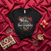 Feliz Navi-Desmadre Shirt, Funny Spanish Christmas T-Shirt, Mexican Holiday Fiesta Top, Skull Maracas Sombrero Poinsettia Design, Unisex Black Tee for Xmas Party Mexicada
