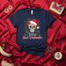 Feliz Navi-Desmadre Sugar Skull T-Shirt, Christmas Day of the Dead Calavera Tee, Festive Poinsettia Santa Hat Mexican Holiday Unisex Shirt Mexicada
