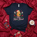 Feliz Navi-Tamal Christmas Tamale T-Shirt Holiday Funny Food Pun Skull Shirt Cute Tamal in Santa Hat Mexican-Inspired Navidad Tee Gift for Tamales Lovers Mexicada