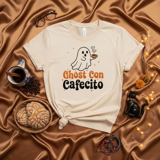 Ghost Con Cafecito Spooky Halloween T-Shirt, Cute Ghost Holding Coffee Mug Tee, Hispanic Latinx Coffee Lover Shirt, Concha Pan Dulce Fall Aesthetic Graphic Top, Unisex Soft Cream Short Sleeve Shirt Mexicada