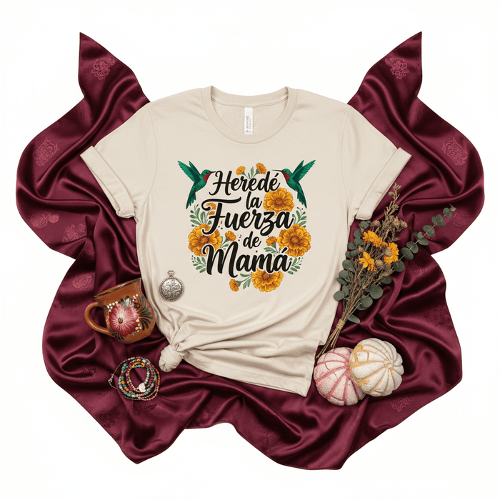 Heredé la Fuerza de Mamá T-Shirt | Spanish Mother's Day Shirt | Floral Hummingbird Design | Regalo para Mamá | Beige Unisex Tee | Latina Mom Gift Idea | Mexican Heritage Inspired Graphic Shirt Mexicada